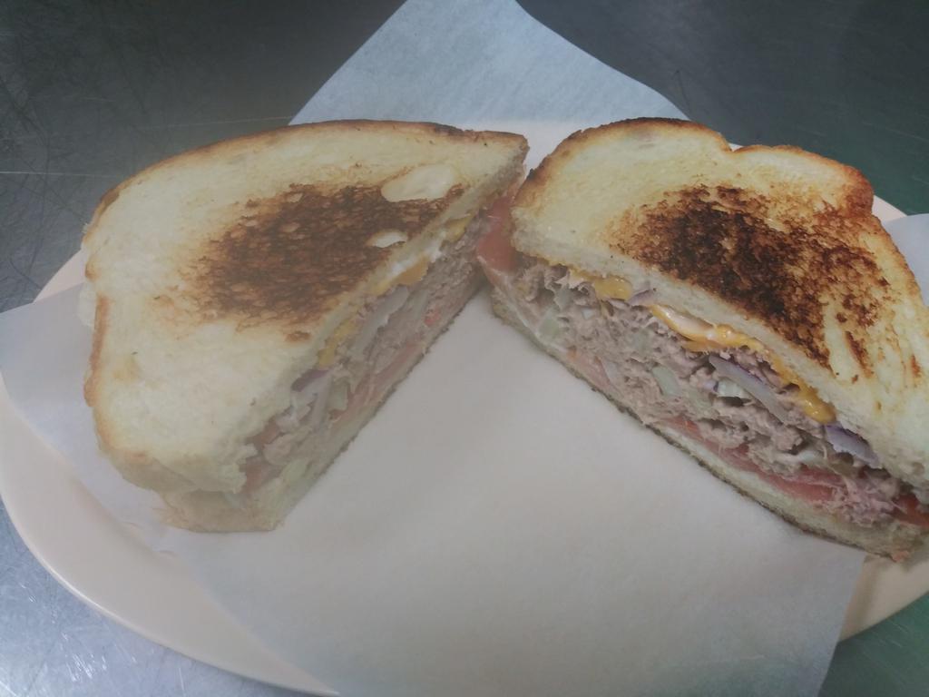 Tuna Melt Sandwich · Toasted sourdough bread, tuna salad, American cheese and tomato.