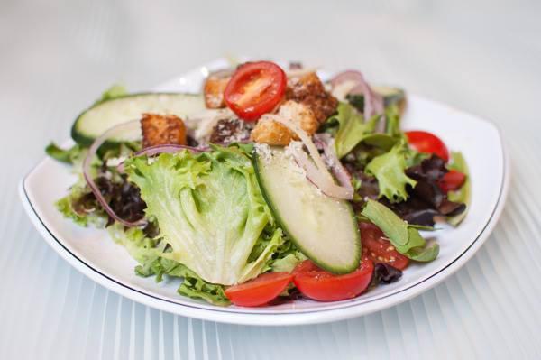 Founders House Salad · Mixed greens, red onions, grape tomato, cucumber, garlic, and herb croutons. Founders house vinaigrette, shaved Parmesan cheese, and ground black pepper.