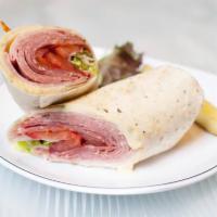 Italian Trio Wrap · Genoa salami, black forest ham, capicola, provolone, spring mix, red onion, and sliced vine ...