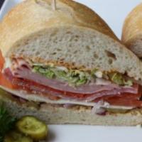 16. Italian Sandwich · Mortadella, salami and pepperoni. Cajun mayo, Yellow mustard, lettuce, tomato, red onion, an...