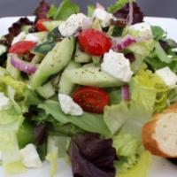 Greek Salad  · Romaine lettuce, cherry tomatoes, red onions, cucumbers, Kalamata olives, and feta cheese. V...