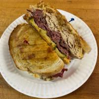 THE REUBENATOR - THE ULTIMATE REUBEN · A half pound of meat consisting of pastrami, corned beef, brown turkey, and roast beef with ...
