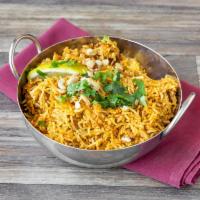 Lamb Biryani · Basmati rice cooked with tender pieces of lamb in Chef's special blend of spices and herbs, ...