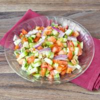 Kachumber Salad · Sliced onions, tomatoes, cucumber and cilantro tossed with lemon juice.