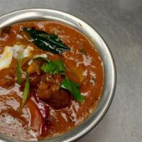 Gongura Mutton Curry · Mutton cooked with andra spices and gangura - a unique variety of green. Origin State: Andra...