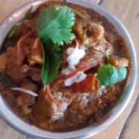 Madras Mutton Curry · Goat meat cooked with a unique blend of regional spices.