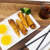 A2. Egg Rolls · 2 pieces. Fried egg rolls with pork and vegetables. Served with sweet orange sauce.