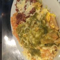 Chilaquiles · 3 eggs scrambled with house-made tomatillo sauce, chihuahua cheese and tortilla chips with r...