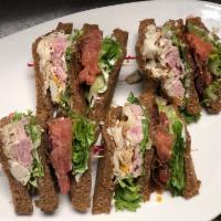 Range Club Lunch · Layers of sliced turkey tenderloin, ham, bacon, lettuce, tomato and aged yellow and white ch...