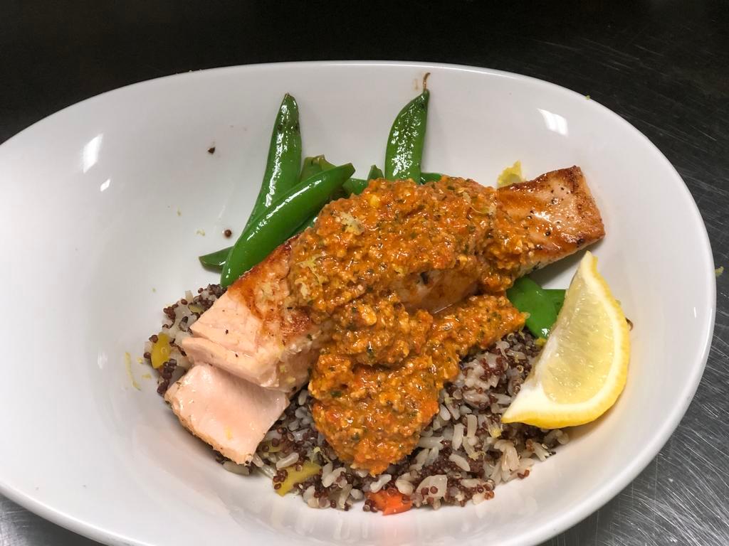 Grilled Salmon Augusta Lunch · Fresh hand-cut grilled salmon, topped with pecan pimento chimichurri and served with snap peas on a bed of quinoa grain blend.