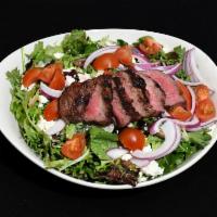 New York Steak Salad · Prime New York strip, onions, and cherry tomatoes served over mixed greens, tossed with Rang...
