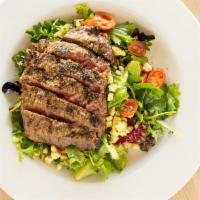 Steak Salad · Petit filet, mixed greens, roasted corn, grape tomatoes, cilantro-lime vinaigrette.