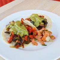 Veggie Tacos · Portobello mushroom, poblano and red peppers, sweet onion. Served a la carte, 2 tacos per or...