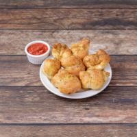 Garlic Knots · Seasoned with garlic and spices. Served with marinara and Chanello's dip.