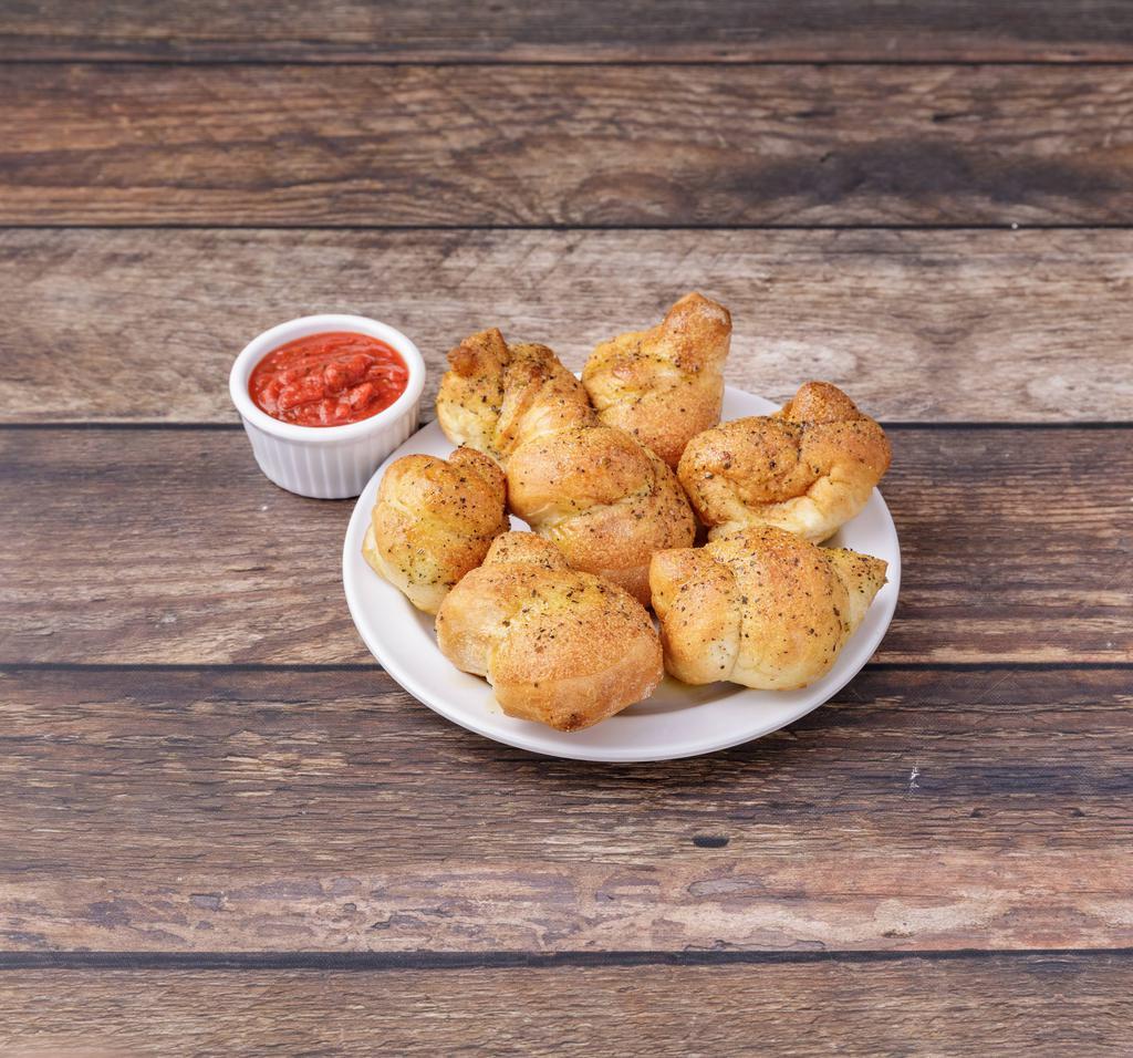 Garlic Knots · Seasoned with garlic and spices. Served with marinara and Chanello's dip.
