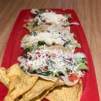 El Americano Tacos · Choice of meat, shredded lettuce, pico de gallo and jack cheese on a flour tortilla.