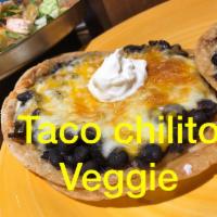 Taco Chilito Tacos · Served on 2 corn tortillas, veggies, black or pinto beans, melted jack and cheddar cheese an...