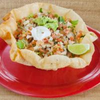 Taco Ensalada · Tortilla bowl served with your choice of meat, black or pinto beans, mixed greens, pico de g...
