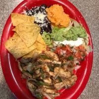 Chicken Fajitas · Served with grilled bell peppers, onions and jalapenos, with rice, beans, sour cream, guacam...