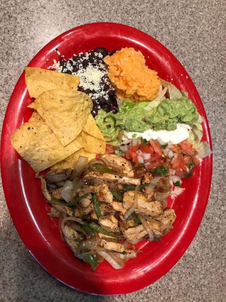 Chicken Fajitas · Served with grilled bell peppers, onions and jalapenos, with rice, beans, sour cream, guacamole, lettuce and 2 tortillas of choice on the side.