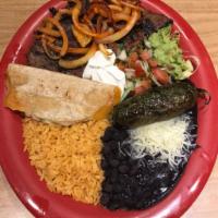Carne Asada Plate · Carne asada served with rice, beans, sour cream, guacamole, lettuce and two tortillas of cho...