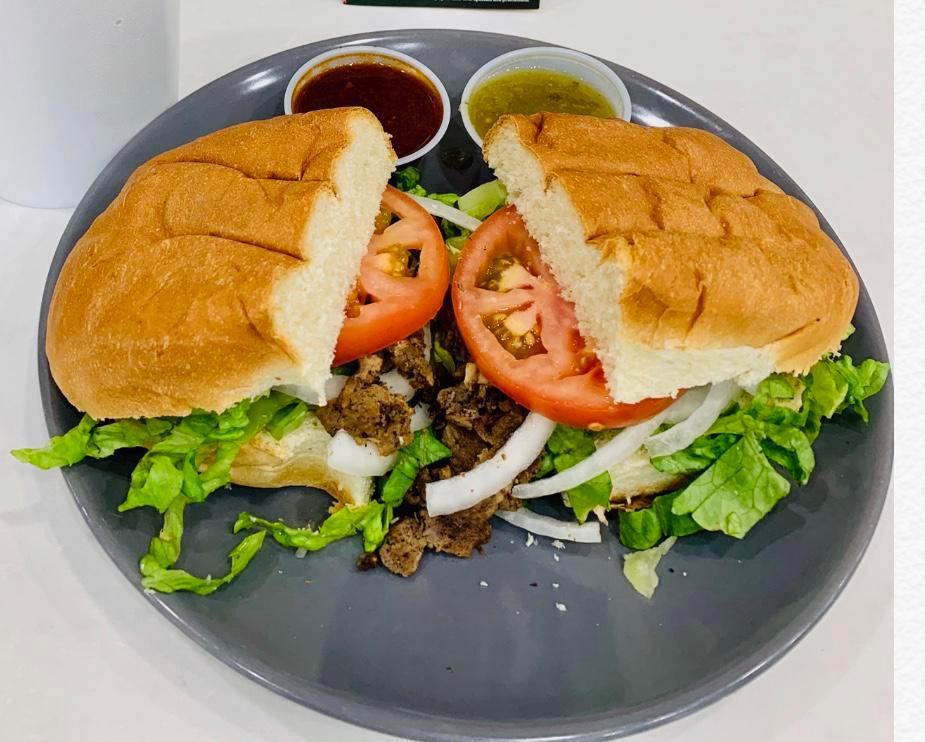 Torta · Torta bread, choice of meat, tomatoes, beans, cheese, onions lettuce, salsa and mayo.