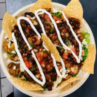 Rice Bowl · Choice of meat , whole beans, cheese, lettuce, pico de gallo, sour cream and tortilla chips ...