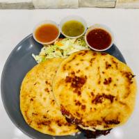 Pupusa · A thick corn tortilla stuffed with chicharron and cheese or mixed.