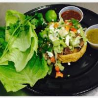 Sopes · Choice of meat, whole beans, cheese, lettuce, pico de gallo, sour cream.