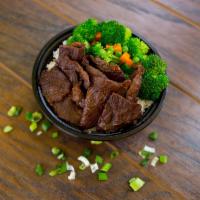 BBQ Beef Bowl · Served over white rice with fresh steamed vegetables.