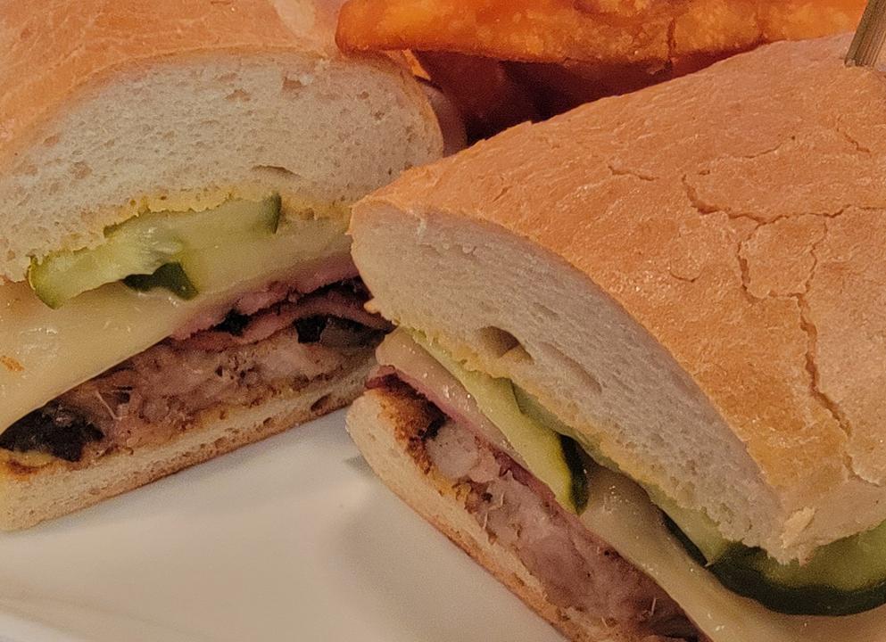 PORK BELLY CUBANO · braised pork belly, sliced smoked ham, dijon mustard, swiss cheese, pickles, french bread