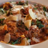 SHORT RIB BOLOGNESE · Tomato braised, hand-cut pappardelle, herb ricotta.