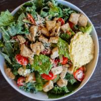 Kale Caesar Chicken Salad · Shredded kale, chopped romaine, antibiotic-free chicken, Parmesan crisp, tomatoes, shaved Pa...