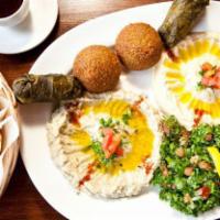 Meza Plate · An assortment of hummus, falafel, baba ghanouj and stuffed grape leaves served with tahini s...