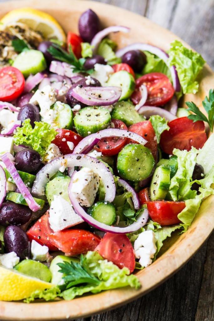 Mediterranean Gyro Salad · Lettuce, tomatoes, cucumbers topped with Kalamata olives and feta cheese tossed in our Greek vinaigrette with pita bread.