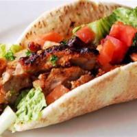 Chicken Kabab Sandwich · Charbroiled marinated chicken served in pita bread with lettuce tomato, onion, and tahini sa...