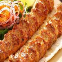 Beef Kabab · 2 skewers of seasoned ground beef minced twice with finely grated onion. Served with saffron...