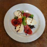 Fresh Mozzarella · Served with roasted peppers and fresh basil.