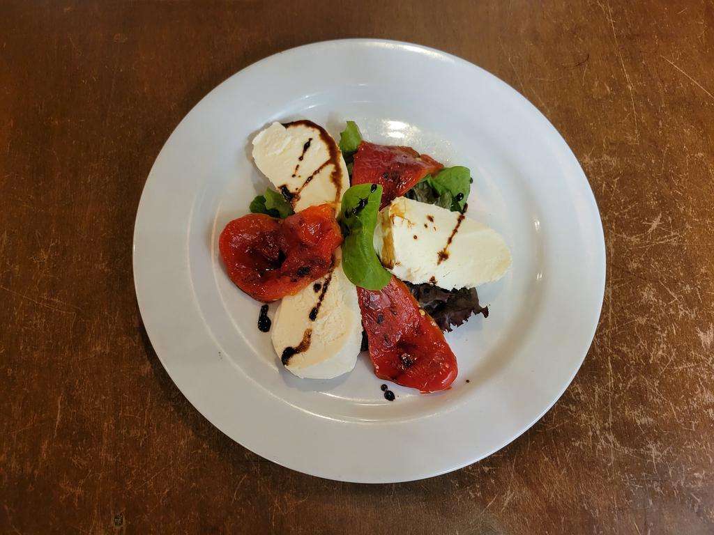 Fresh Mozzarella · Served with roasted peppers and fresh basil.