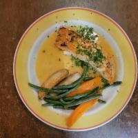 Broiled Salmon · In a lemon and white wine sauce.