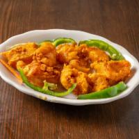 14. Fish Pakora · Boneless fish marinated in batter spiced to your desire and deep fried to a crisp golden col...