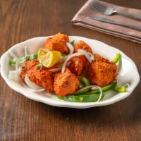 21. Chicken Tikka · Tender boneless pieces of chicken breast marinated in yogurt and a savory blend of spices. S...