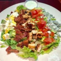 Cobb Salad · Chicken, bacon, egg, blue cheese crumbles and tomatoes. Salad comes with a choice of Italian...