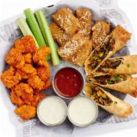 Jack's Sampler · Three of our best appetizers on one plate. Southwest Eggrolls (w/ Avocado Cream), Mozzarella...