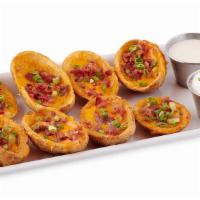 Potato Skins · Crispy potato skins stuffed with Aged Cheddar cheese, chives, smoked bacon and served with a...