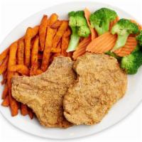 Fried Pork Chops · Two Hand Breaded Pork Chops served with two side and a side of Cream Gravy