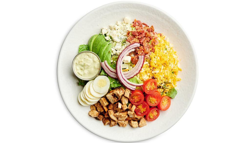 Chicken Cobb Salad · Grilled Chicken, Chopped Bacon, Jack and Cheddar Cheese, Bleu Cheese Crumbles, Cherry Tomatoes, Fresh Avocado, Sliced Boiled Egg and Red Onion. Served with Avocado Ranch Dressing on the side