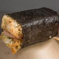 Spam Musubi · Grilled spam smothered in teriyaki sauce and wrapped in rice and nori love.