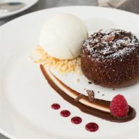 Molten Lava Cake · Served with one scoop of strawberry ice cream