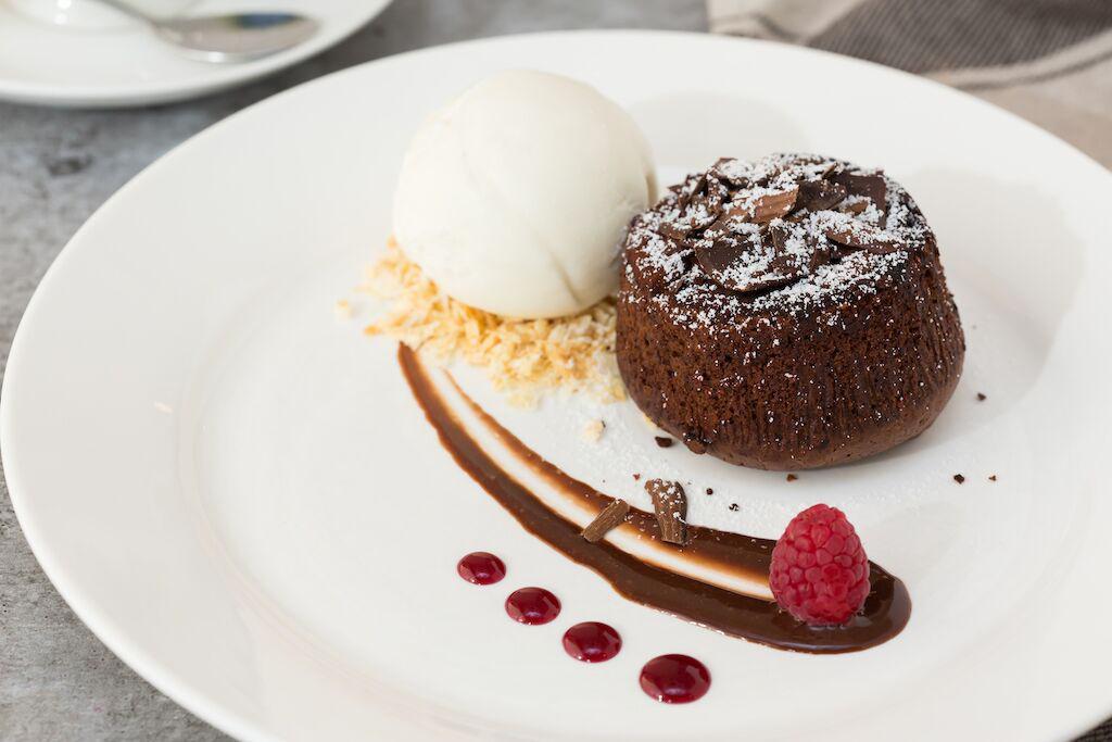 Molten Lava Cake · Served with one scoop of strawberry ice cream